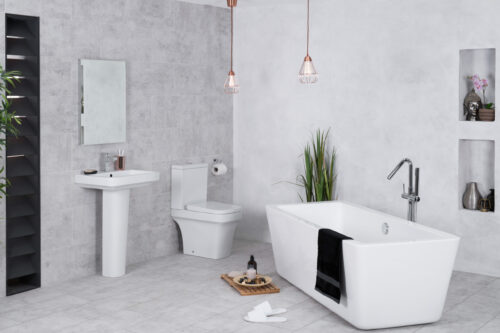 A modern bathroom with a toilet and bathtub